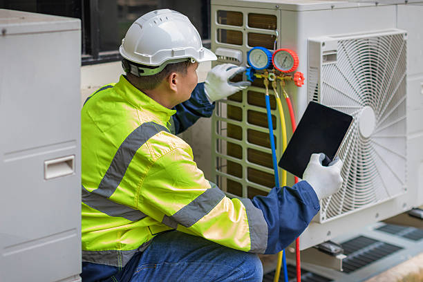 Professional Heat Pump Repair technician working in Yukon, MO